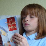 Girl absorbed in reading a story