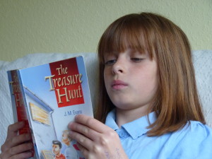 Girl absorbed in reading a story