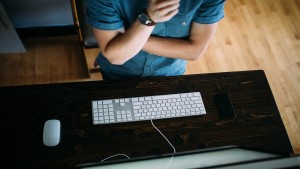 man sitting at keyboard