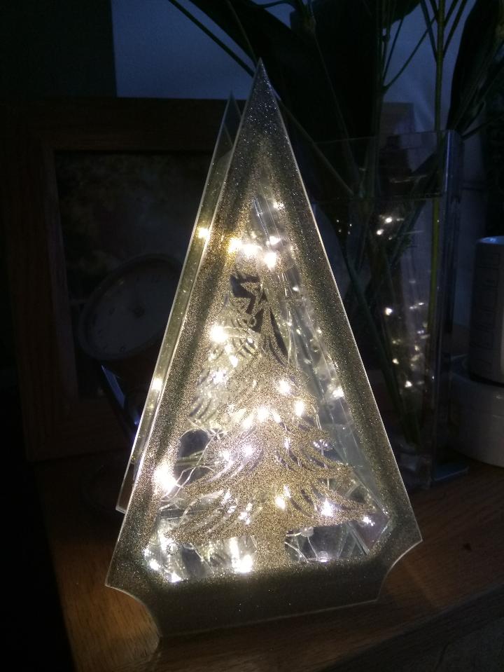 Christmas lights in a Christmas tree acrylic box