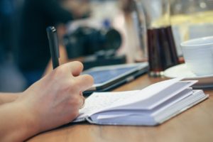 writing in a café