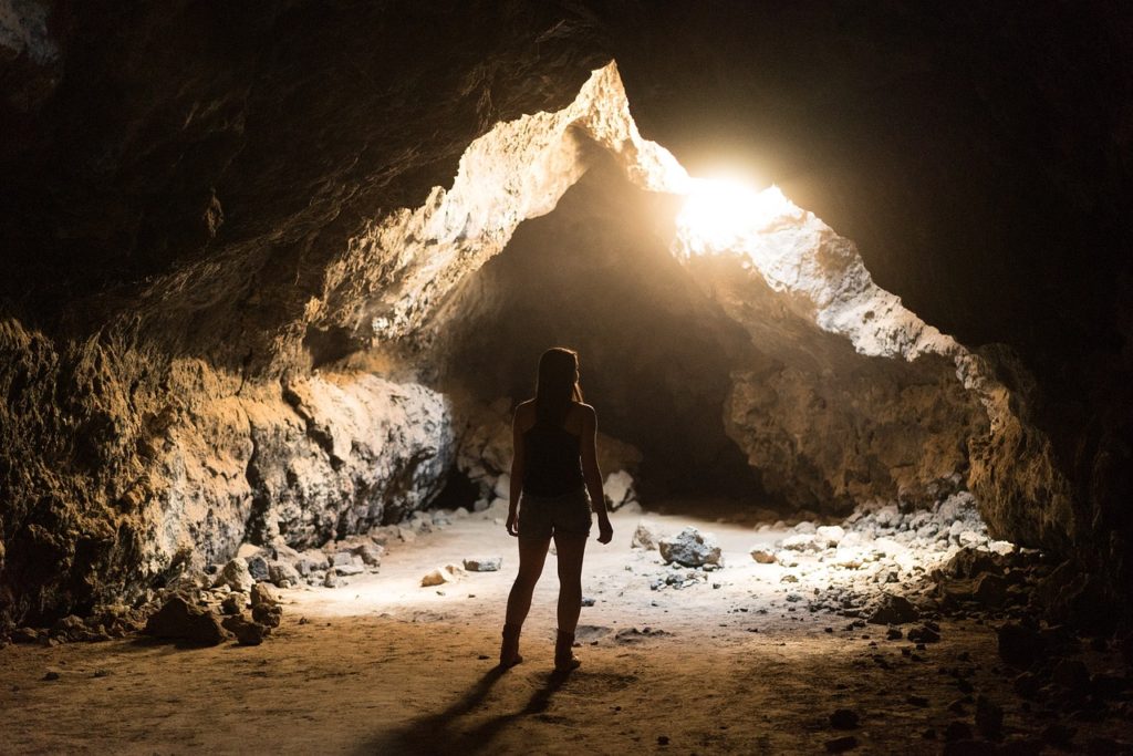 Woman in a cave.