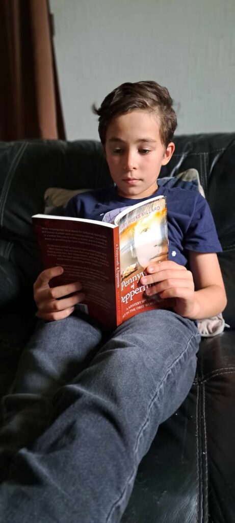 Boy reading Christian children's book